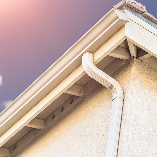 Gutters on a house, viewed from below.